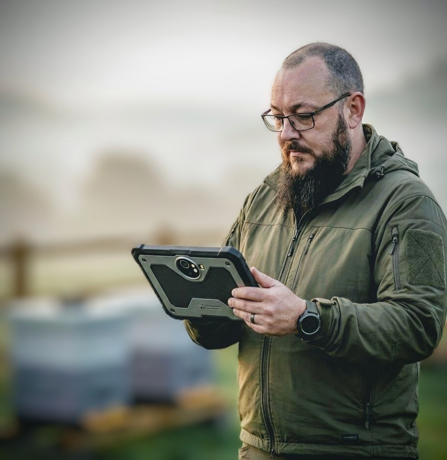 Founder Markus Cox utilizing ruggedised tablet for aerial mapping and AI monitoring